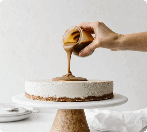 smearing vegan chocolate on cake