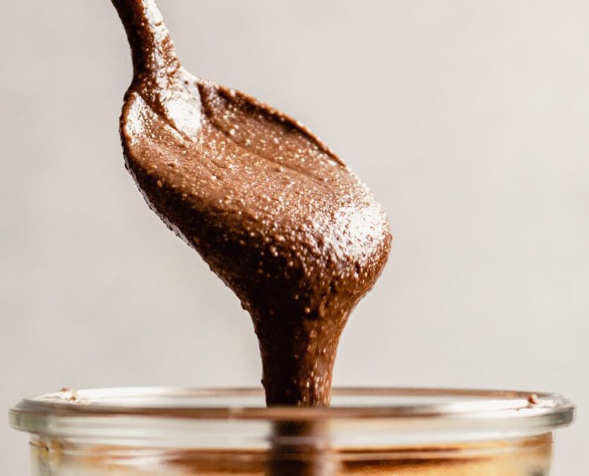chocolate spread flowing from a spoon