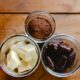 3 jars filled with cocoa powder, cocoa butter, and cocoa bean